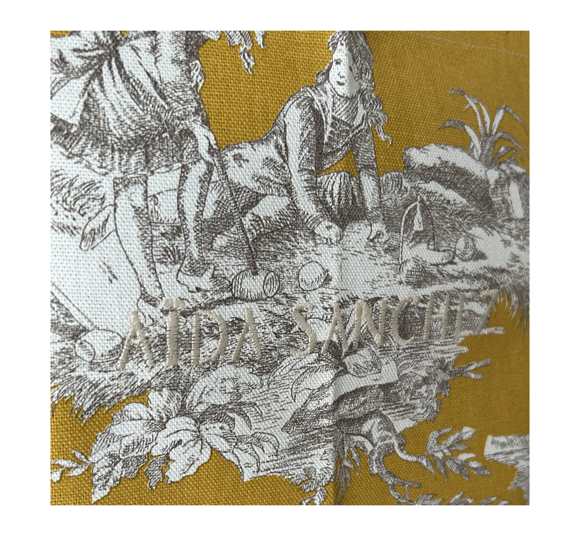 Aida_Sanchez_Apron_mustard_logo